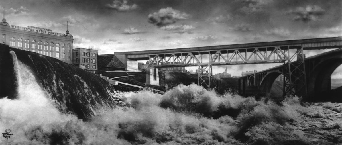1915: Peak spring flows of the Spokane River crash over the 1890 rock crib dam below the Washington Water Power Company’s Post Street substation and upstream of the Monroe Street Bridge. Prominently spanning the river is the Union Pacific Railroad trestle that carried trains over the river for 59 years before it was demolished in October 1973 in preparation for Expo ’74. (SPOKESMAN-REVIEW PHOTO ARCHIVES)