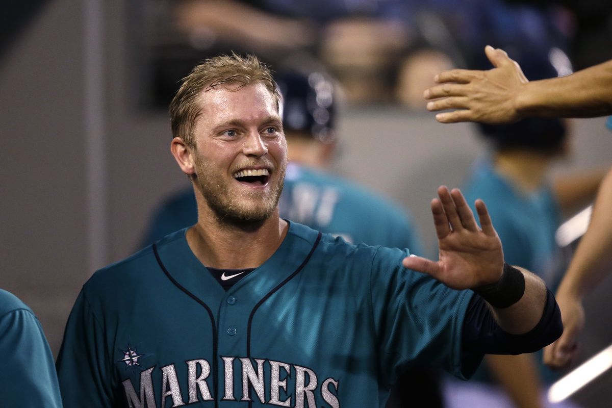 Seattle’s Michael Saunders celebrates after his home run against the Minnesota Twins in the seventh inning put the Mariners up 2-0. (Associated Press)