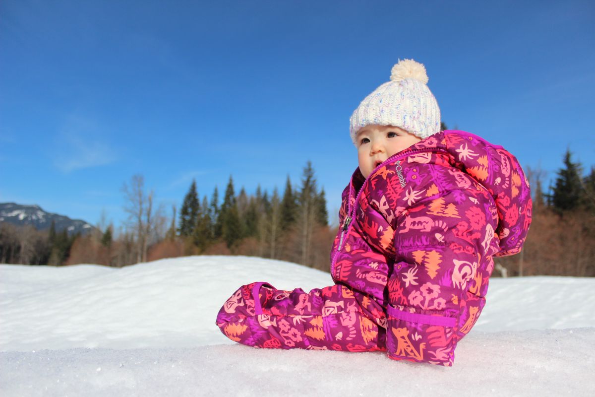 With the right clothing, little ones can stay comfortable outside all winter long. Mild days, like this sunny January 2022 visit with the author’s daughter, Lena, to the Easton Reload Sno-Park with temperatures in the high 20s Fahrenheit, also make winter outings less daunting.  (Gregory Scruggs/The Seattle Times)