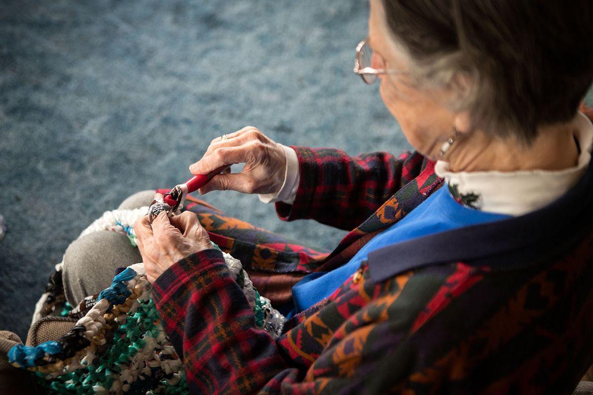 Sister Kathy Roberg demonstrates using a Q hook to crochet plastic bags into mats for the homeless on March 25, 2021.  (Libby Kamrowski/ THE SPOKESMAN-REVIEW)