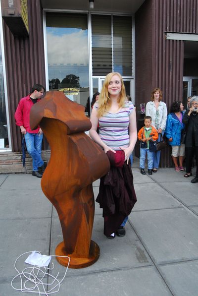 Lily Neal  stands beside the figure she posed for when she was nine months pregnant. Associated Press photos (Associated Press photos / The Spokesman-Review)