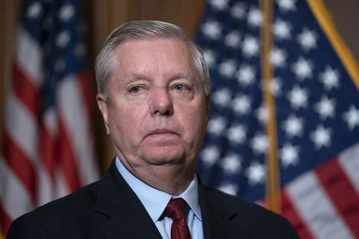 Sen. Lindsey Graham, R-S.C., the ranking member of the Senate Budget Committee, waits to speak to reporters following bi-partisan passage of the Ending Forced Arbitration of Sexual Assault and Sexual Harassment Act, at the Capitol in Washington, Feb. 10, 2022. Graham is among a handful of Republicans declaring a willingness to back President Joe Biden
