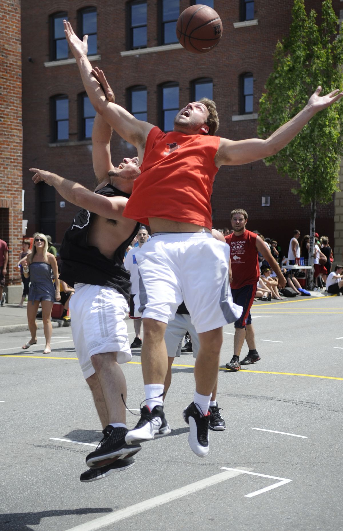 Mike Daffern of the Fish Sticks and Johnny Fredrick of the Bobby Dills compete for a rebound Saturday, June 26, 2010, at Hoopfest. The Fish Sticks won the game in overtime 16-15. (Colin Mulvany / The Spokesman-Review)