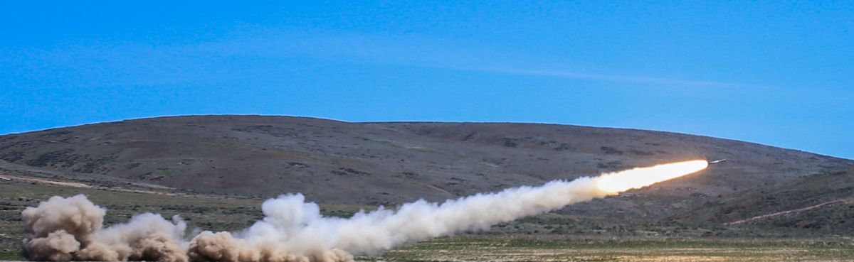 An Army truck fitted with the High Mobility Artillery Rocket System fires a rocket in a field at Yakima Training Center during a training exercise last month in the high desert of Central Washington. (Thomas Soerenes)