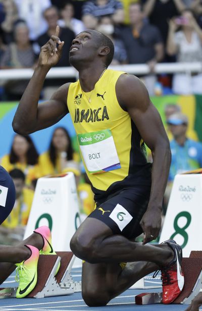 Jamaica’s Usain Bolt prepares before a men’s 100-meter heat on Saturday. (Matt Dunham / Associated Press)