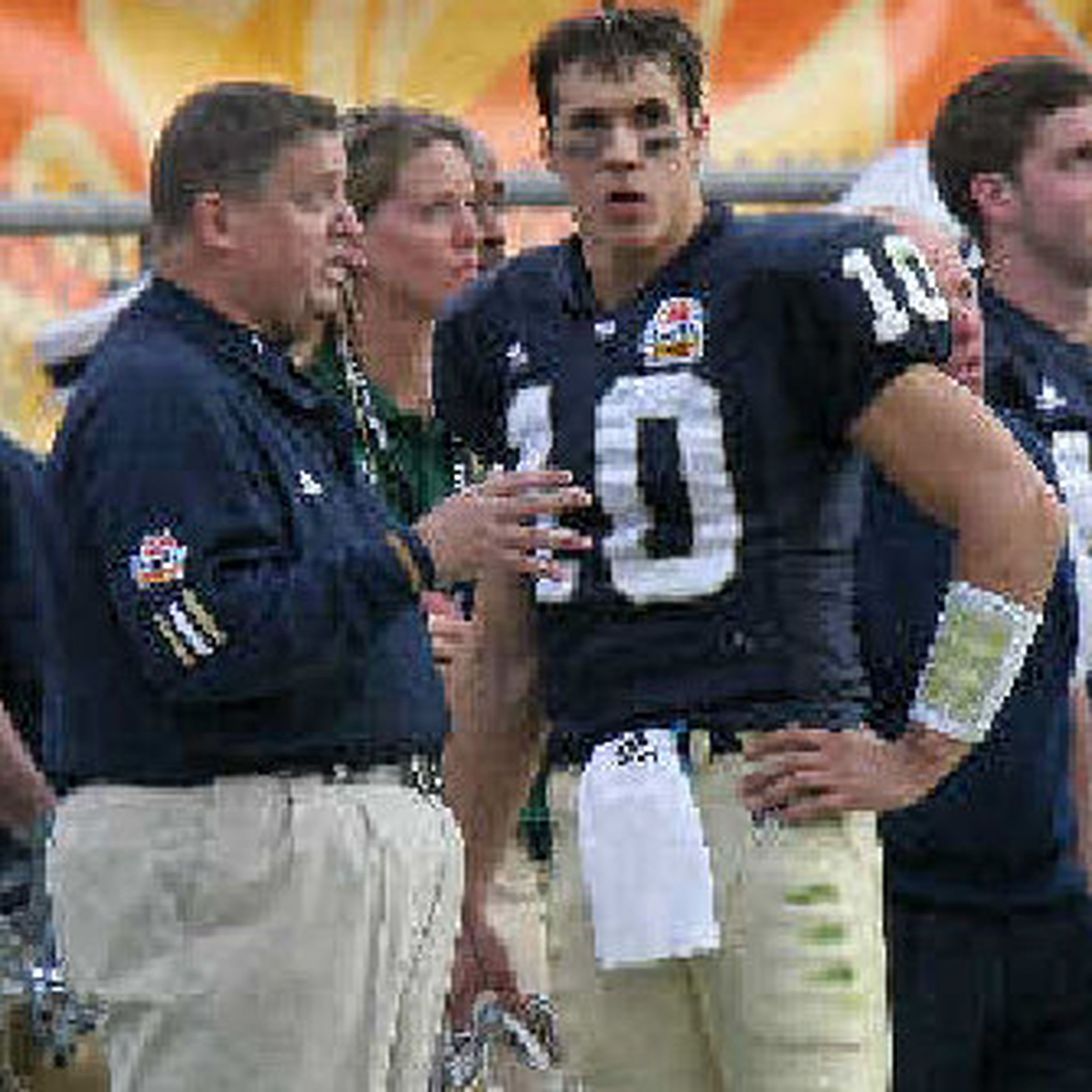 Brady Quinn, a quarterback from Notre Dame, holds a jersey after