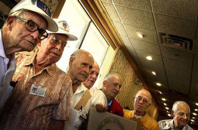 
Members of the China-Burma-India Veterans Association, from left, Andy Kelly, Ken Lobdell, Hal Barnhart, Earl Reeves, Maron Moore, Ed English and Wayne Westerholm, gather at their group's last official meeting  Saturday. 
 (Jed Conklin / The Spokesman-Review)
