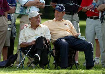 
Arnold Palmer, left, and Larry Nelson share a light moment while waiting on the eighth tee. 
 (Associated Press / The Spokesman-Review)