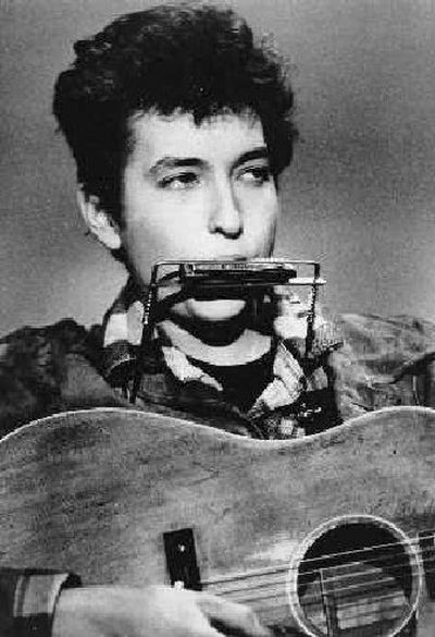 
Folk singer and songwriter Bob Dylan plays the harmonica and acoustic guitar in this March 1963 photo taken at an unknown location. 
 (File/Associated Press / The Spokesman-Review)