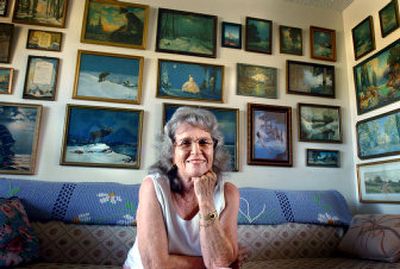 
Kathleen Winters with her collection of lithographs. 
 (The Spokesman-Review)