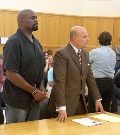Lawrence Taylor, left, and his attorney, Arthur Aidala, listen during arraignment Thursday.  (Associated Press)