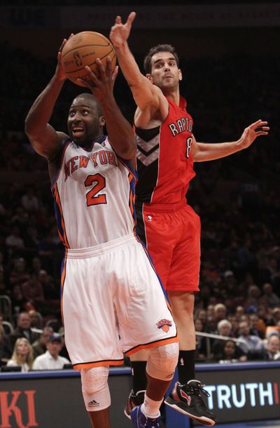 The Knicks’ Raymond Felton drives past Toronto’s Jose Calderon.  (Associated Press)