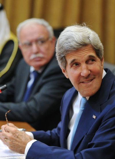 U.S. Secretary of State John Kerry and Palestinian Foreign Minister Riyad al-Maliki, left, attend the Arab League Peace Initiative on July 17. (Associated Press)
