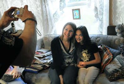 
Ashley Cate, right, has a picture taken after meeting with her new Big Sister Cyndi Holcomb. 
 (Dan Pelle / The Spokesman-Review)