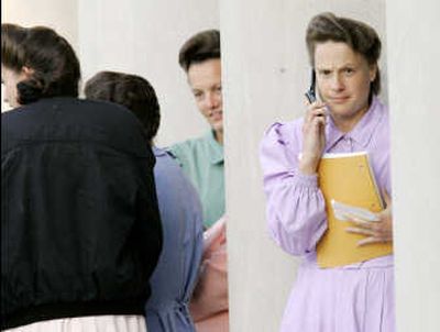 
Marie, right, a mother of three boys,  and other members of the Fundamentalist Church of Jesus Christ of Latter Day Saints wait outside the county  courthouse in San Angelo, Texas, on Friday. Associated Press
 (Associated Press / The Spokesman-Review)