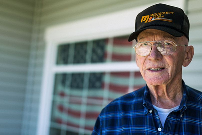 Curtis Benham, of Post Falls, recently received a notice from his neighborhood���s homeowners association that the flag in his front window was a violation of their covenants, conditions and restrictions. The notice cited ���inappropriate curtains��� as the violation. (Shawn Gust/press)