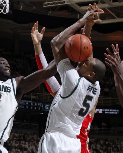 Michigan State's Adreian Payne uses his face in an attempt to grab a rebound in a loss to Ohio State on Sunday. (Associated Press)