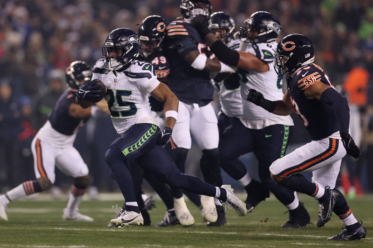 Seattle Seahawks running back Kenny McIntosh runs the ball against the Chicago Bears during the first quarter Thursday night at Soldier Field in Chicago.  (Getty Images)