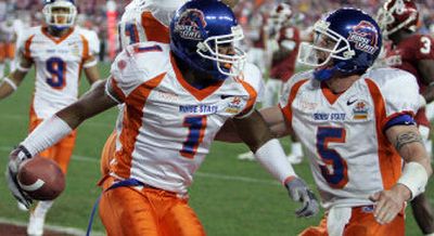 
Boise State's Jerard Rabb (1) celebrates with Jared Zabransky after Rabb scored the game-tying touchdown against Oklahoma in the fourth quarter of the Fiesta Bowl.
 (Associated Press / The Spokesman-Review)