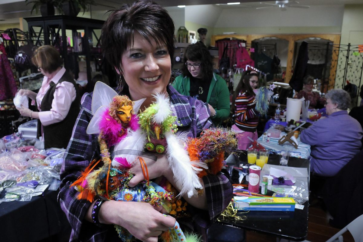 Debbie McCulley shows off some of her Wackadoodle dolls at Shear Illusions  Salon and Boutique in Spokane Valley. (PHOTOS BY J. BART RAYNIAK)