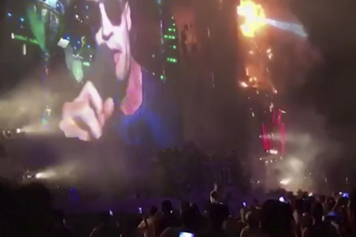 In this image made from video provided by David Belmonte, flames engulf the outdoor stage during the “Tomorrowland” electronic music festival in Barcelona, Spain, Saturday night, July 29, 2017. A spectacular fire at the music festival forced the evacuation of over 20,000 concertgoers, the regional government says. (David Belmonte)