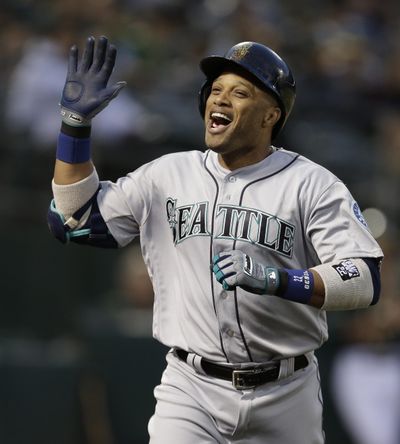 Seattle’s Robinson Cano celebrates after hitting a home run off Oakland’s Sonny Gray in the fourth inning Tuesday. (Ben Margot / Associated Press)