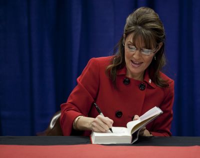 Sarah Palin signs her autograph at Barnes and Nobles during the first stop of her book tour in Grand Rapids, Mich. on Wednesday, Nov. 18, 2009. (Adam Bird / Fr104466 Ap)