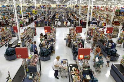 
Shoppers check out at the counters of the Wal-Mart supercenter in south Reno. 
 (Associated Press / The Spokesman-Review)