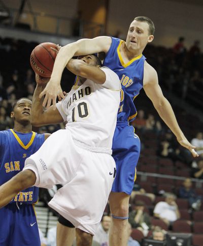 San Jose State’s Garrett Ton fouls Idaho’s Landon Tatum during the first half of a Western Athletic Conference tournament quarterfinal on Thursday. (Associated Press)