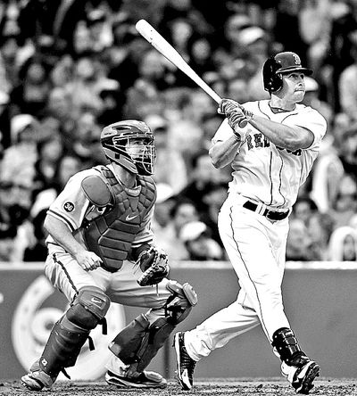 Boston Red Sox's Daniel Nava, right, watches his grand slam in front of Philadelphia Phillies' Brian Schneider. (Associated Press)