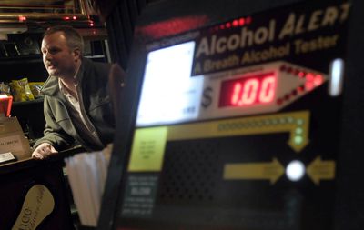 Wade Anton of Anton Industries, talked about the coin- operated breath alcohol tester at the Slab Inn on Jan. 16. (Kathy Plonka / The Spokesman-Review)