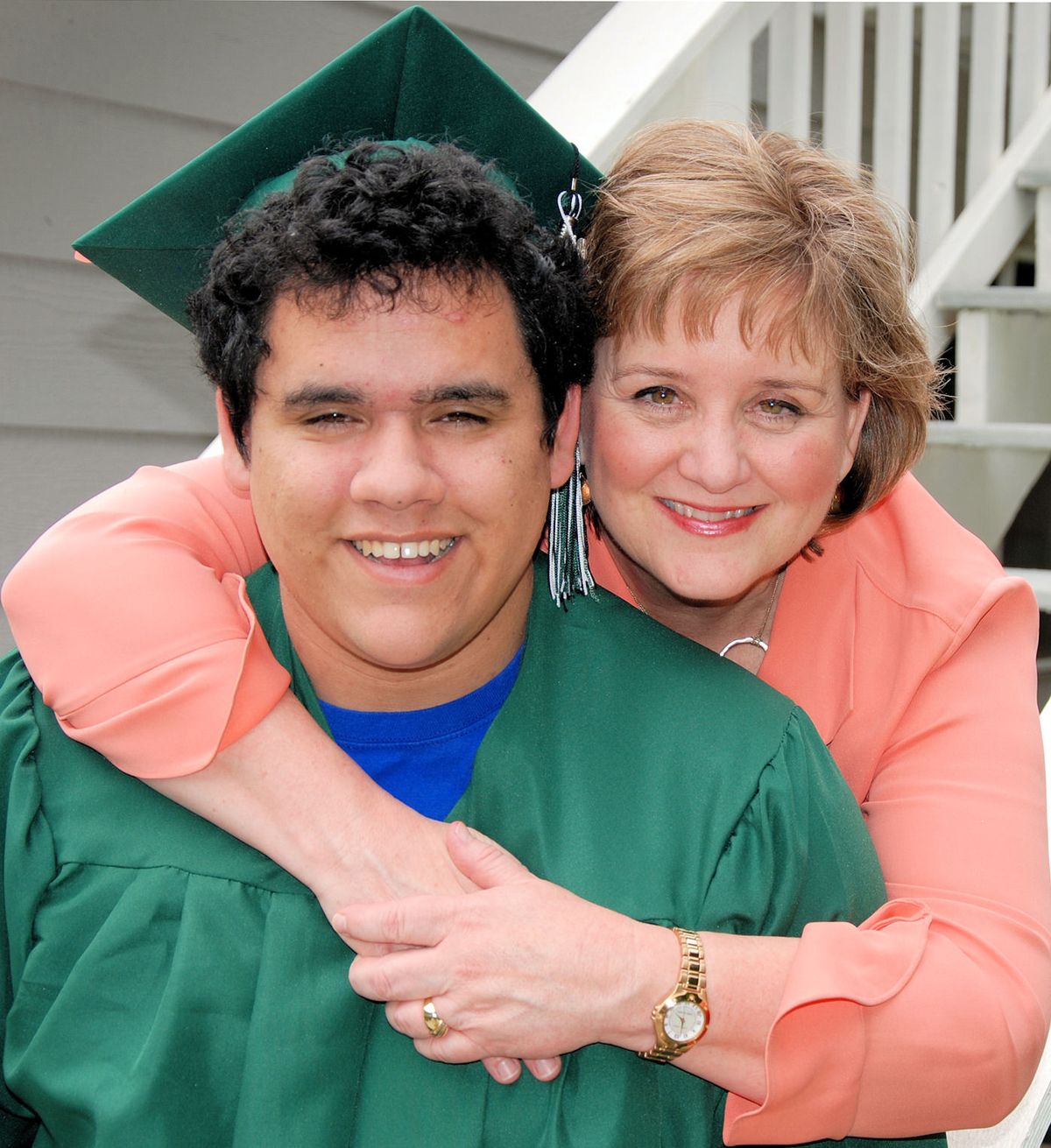 Alex Drake poses with his mother, Catherine Johnston, June 6 after graduating from Avanti, an alternative high school in Olympia. (Photo by Tony Wadden)