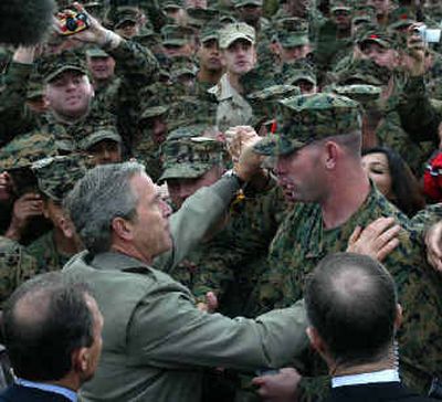 
President Bush shakes hands and meets military personnel after making remarks Tuesday  in Camp Pendleton, Calif. 
 (Associated Press / The Spokesman-Review)