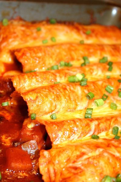 These butternut squash and black bean enchiladas from Skinnytaste.com warmed the kitchen with the smell of simmering tomato sauce and spices. (Lorie Hutson)