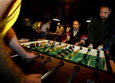 
Steph Ohashi, 34, left, and her partner, Chad Kinner, 36, are members of the Seattle Foosball League.
 (Knight Ridder / The Spokesman-Review)