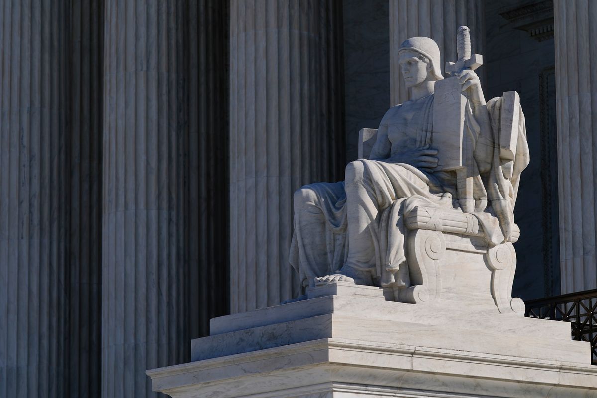 "The Authority of Law," sculpted by James Earle Fraser, stands outside the Supreme Court building on Capitol Hill in Washington, Monday, Feb. 21, 2022. (Patrick Semansky)