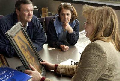 
An appraiser considers an icon at the MAC's annual Antique Appraisal Days.
 (File/ / The Spokesman-Review)