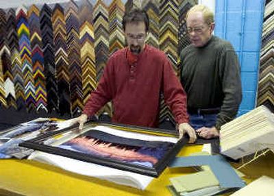 
At Spokane Art Supply, custom framer Kevin Smith helps customer Rick Diffley find the proper frame for a photograph. Spokane Art Supply will celebrate its 50th anniversary in November.
 (The Spokesman-Review)