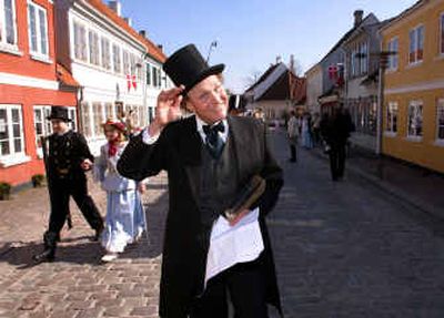 A man dressed in the trademark top hat of Hans Christian Andersen walks the streets of Odense, Denmark, to honor Andersen's 200th birthday. Celebrities from across the globe gathered in Denmark earlier this month to honor Andersen, the author of