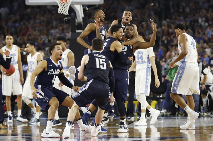 Villanova players celebrate their national championship after defeating North Carolina 77-74. (David J. Phillip / Associated Press)