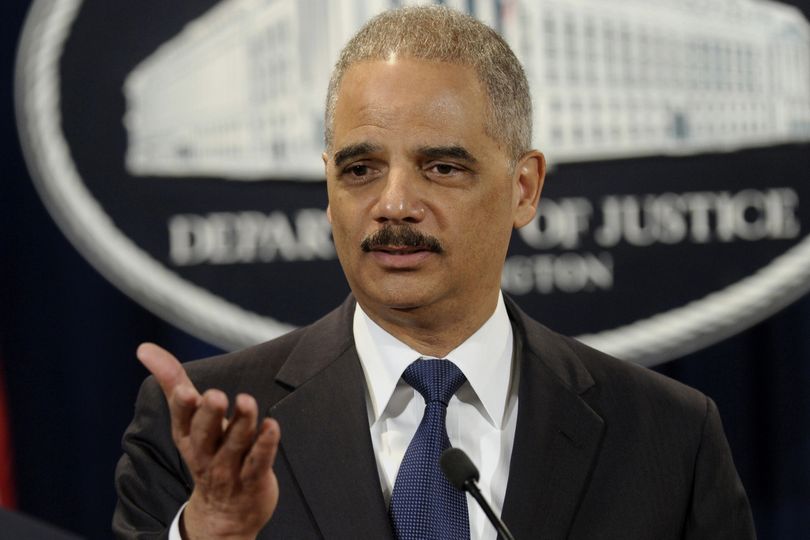 Attorney General Eric Holder announces a $1.2 billion settlement with Toyota over its disclosure of safety problems, Wednesday, March 19, 2014, during a news conference at the Justice Department in Washington. (Susan Walsh / Associated Press)