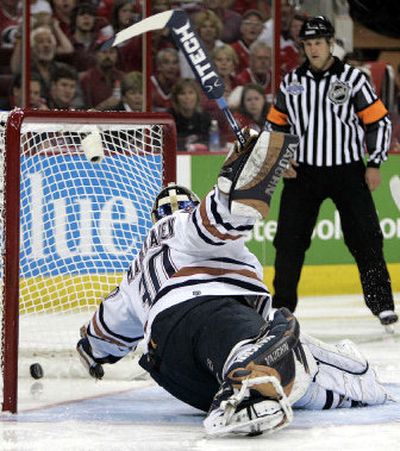 
It was a long night for Oilers goaltender Jussi Markkanen, who let this one get away in third period of Wednesday's game. 
 (Associated Press / The Spokesman-Review)