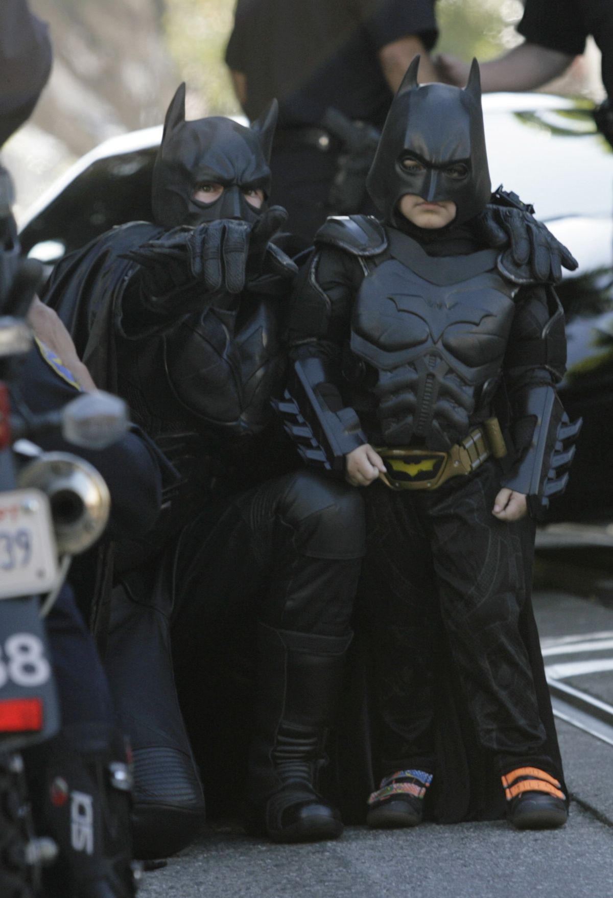Batman assists Batkid Miles Scott, 5, as he prepares to save a damsel in distress Friday in San Francisco.