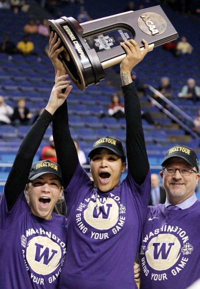 From left to right, Washington's Alexus Atchley, Talia Walton and head coach Mike Neighbors react with the trophy after winning a regional final women's college basketball game in the NCAA Tournament against Stanford in Lexington, Ky., Sunday, March 27, 2016. (James Crisp / AP Photo)