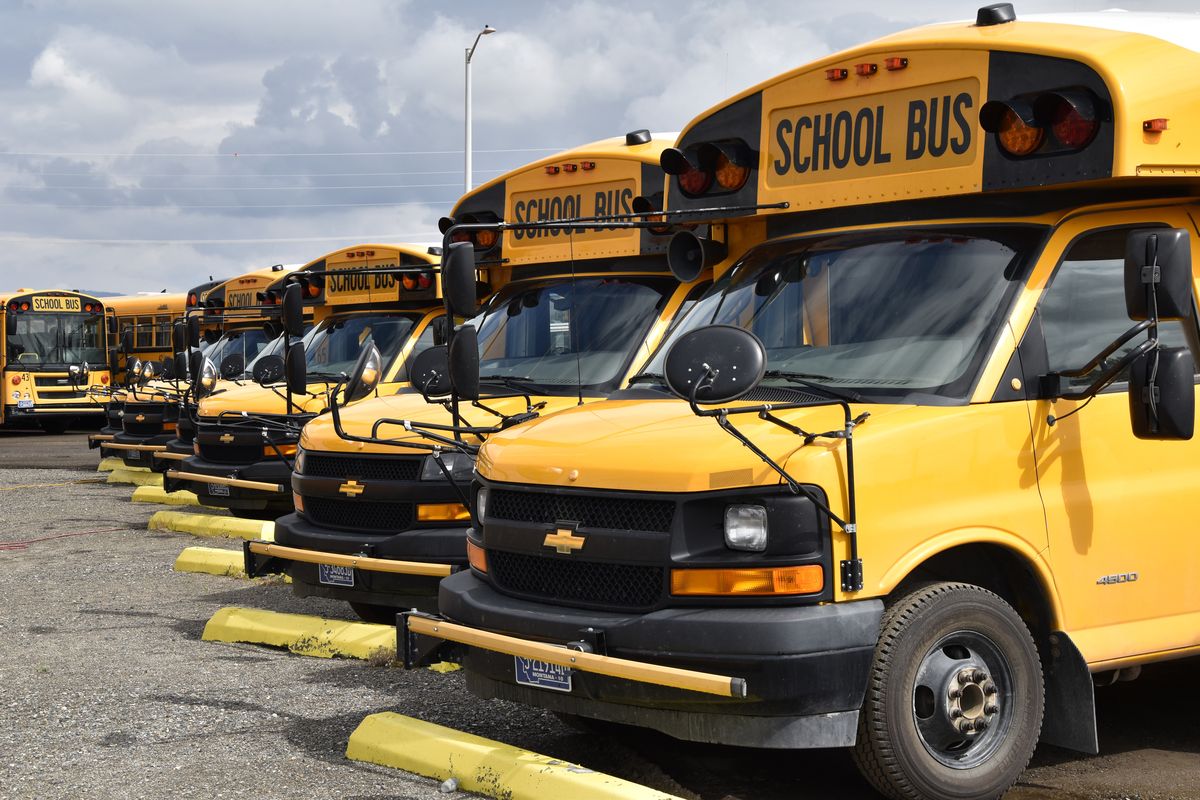School buses parked in Helena, Mont., ahead of the beginning of the school year, Friday, Aug. 20, 2021. School districts across the country are coping with a shortage of bus drivers, a dilemma that comes even as they struggle to start a new school year during a new surge of the coronavirus pandemic.  (Iris Samuels)