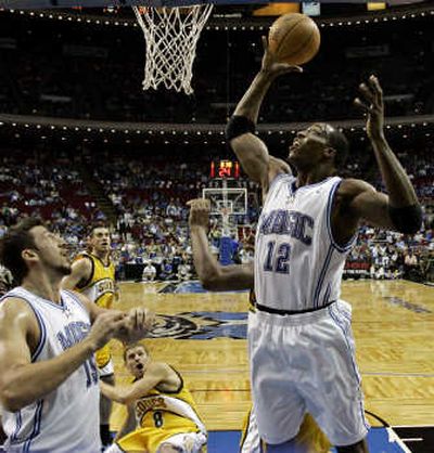 
Orlando's Dwight Howard has an intent audience as he puts up a shot. Associated Press
 (Associated Press / The Spokesman-Review)