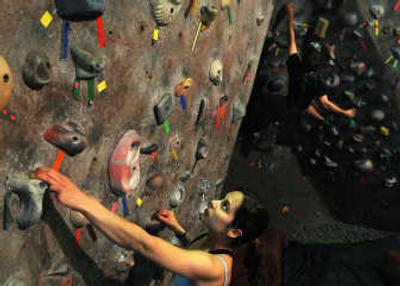 
Melissa Main, training here at Wild Walls in Spokane, has ascended the vertical world of sport climbing to gigs in China, Europe and South America. 
 (Rajah Bose / The Spokesman-Review)