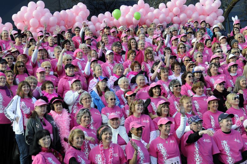Breast cancer survivors pose for a group photograph behind the INB Preforming Arts Center on Sunday, April 17, 2011. Over 8,700 people participated in the 6th annual Susan G. Komen Race for the Cure Eastern Washington.  (J. Rayniak / The Spokesman-Review)
