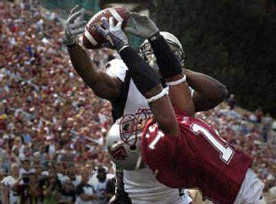
WSU cornerback Tyron Brackenridge steps in front of Idaho's Tariq Ikharo to knock away a pass in the end zone Saturday. 
 (Christopher Anderson / The Spokesman-Review)