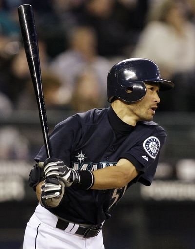 Ichiro Suzuki watches his first of two home runs, this in the fifth inning.  (Associated Press / The Spokesman-Review)